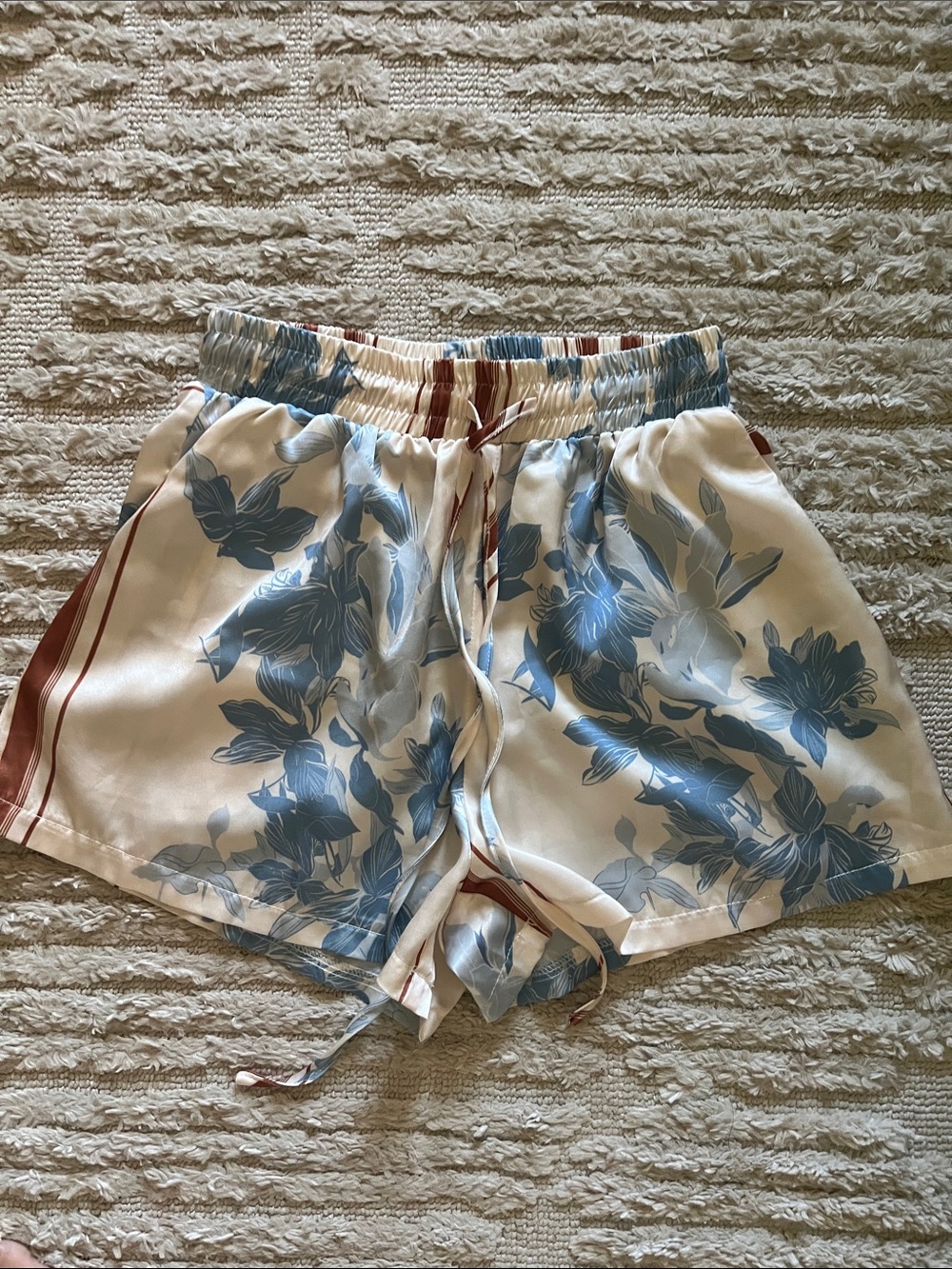 Petal & pup Lara light blue floral shorts.